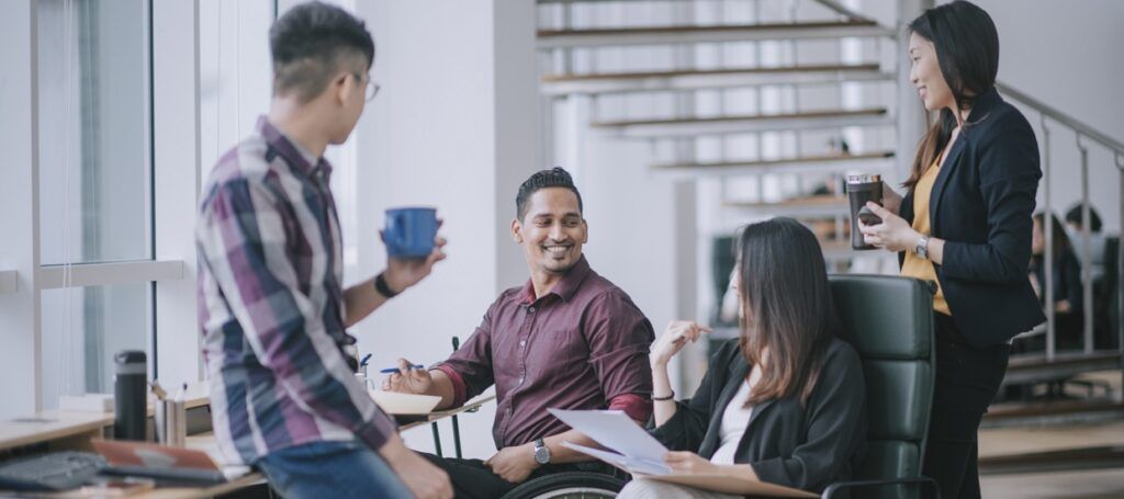 Colleagues talking in office