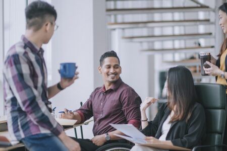 Colleagues talking in office