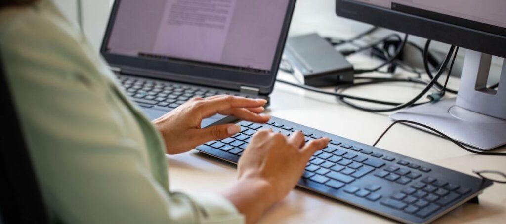 Female typing on laptop