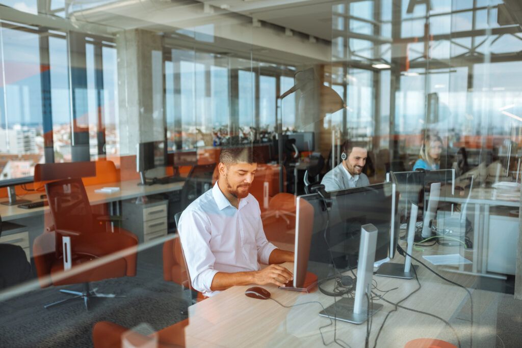 male working at a desk in an office