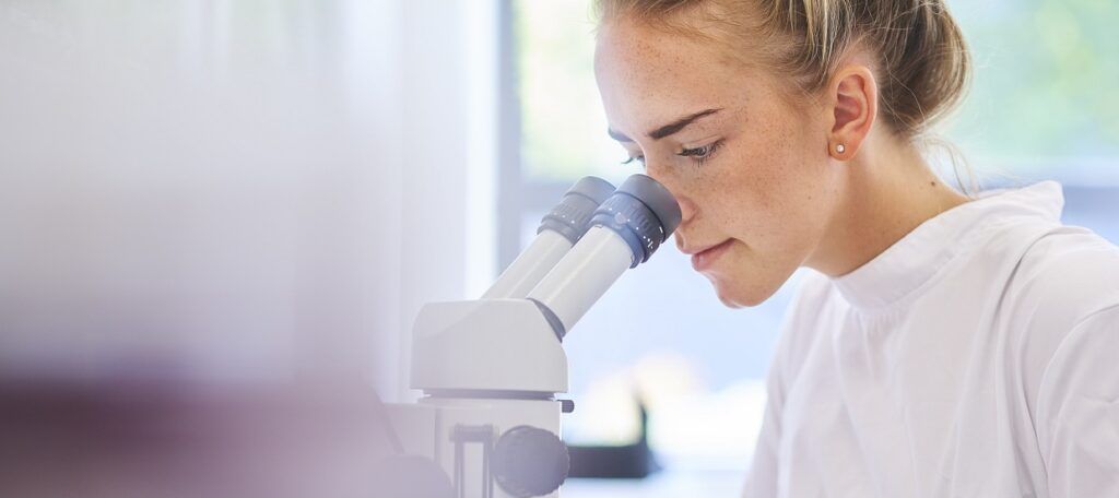 PhD student working in a lab at university