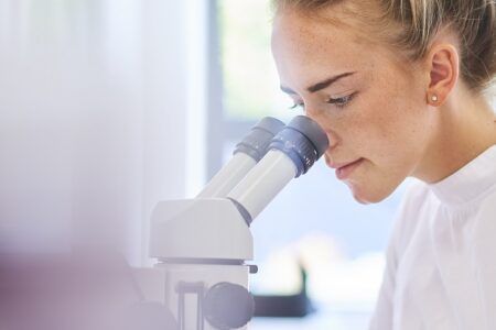 PhD student working in a lab at university