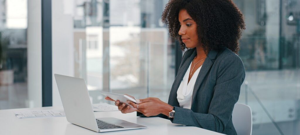 Woman in office taking part in interview asessment on laptop