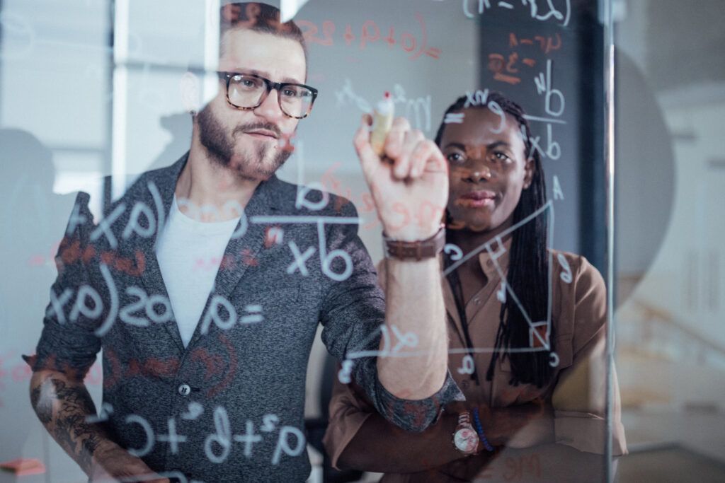 mathematician working on a wipe board